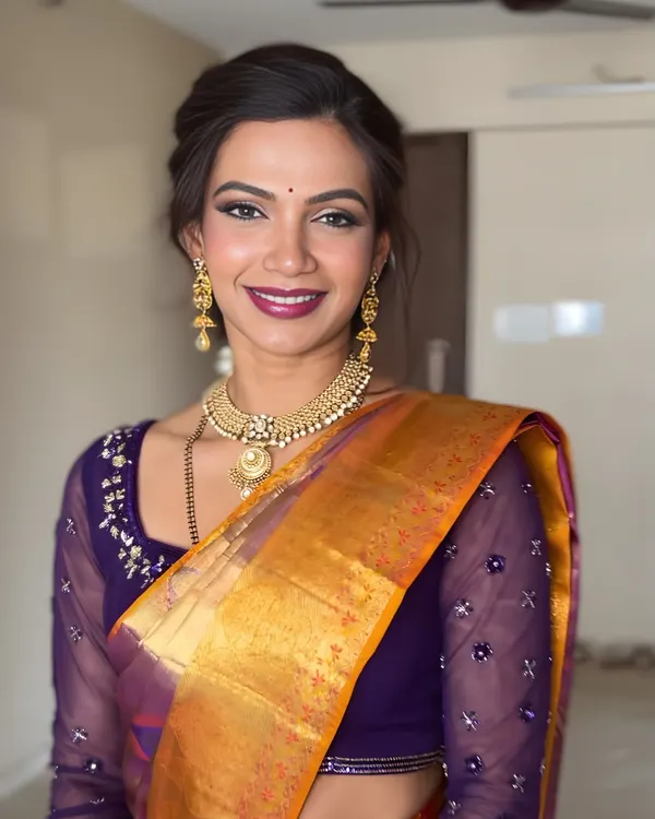 This is my signature soft glam, perfect for any celebration. I focused on creating luminous skin, defining the eyes with a touch of shimmer, and finishing with a beautiful berry lip to complement this traditional silk saree.