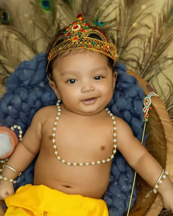 Our little Bal Gopal with the sweetest smile. This Janmashtami-themed shoot captures the playful and divine spirit of Krishna.