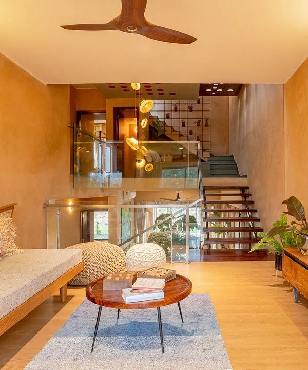 The informal living area in the Terravana Villa is a curated space that blends artisan furniture with traditional materials. I used lime plaster on the walls and Kota stone for the flooring to create an earthy, tactile environment that promotes a sense of well-being and connection to nature.