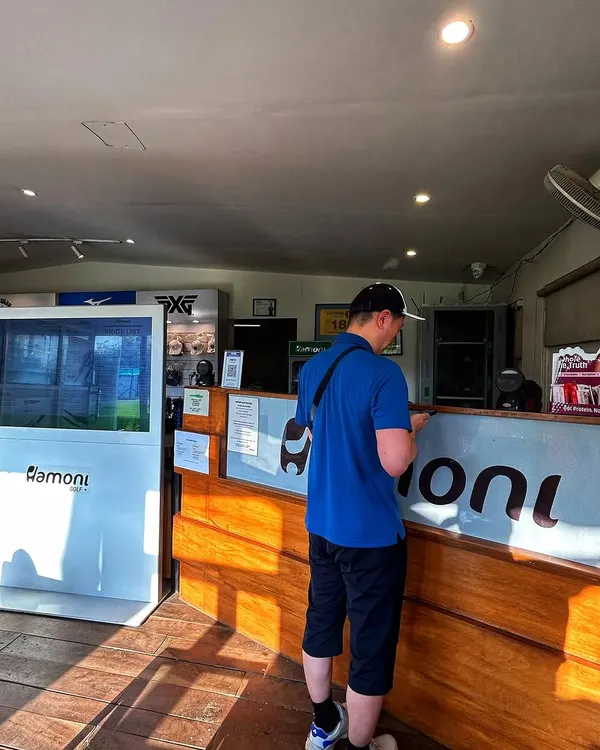 A player checks in at our ProShop reception, ready to get his session started.