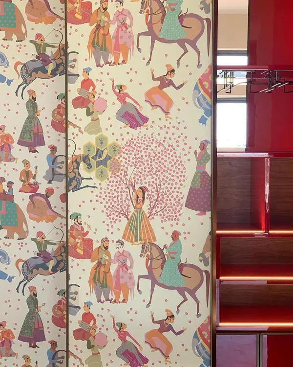 A detail from a custom bar unit designed for a residential project. I used this beautiful wallpaper depicting 'Draupadi ka Swayamvar' to clad the doors, turning the bar into a contemporary narrative piece that tells a joyful, festive story.
