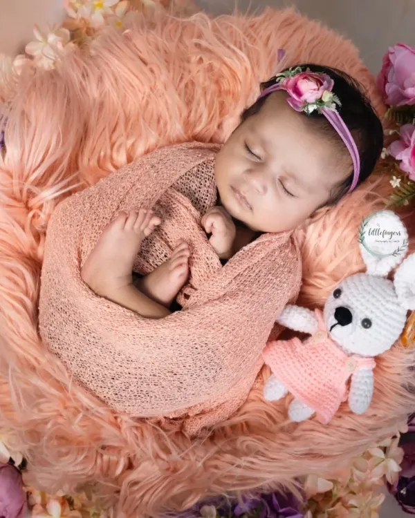 Curled up and dreaming, surrounded by soft textures and flowers. My newborn sessions are designed to be calm and peaceful, focusing on the delicate beauty of your sleeping baby.