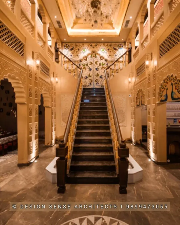 This is the kind of 'wow' moment I love to create. For this luxury Indian restaurant, we designed a grand double-height entrance with a sweeping staircase, intricate jaali screens, and traditional archways to give every guest a royal welcome the moment they step inside.