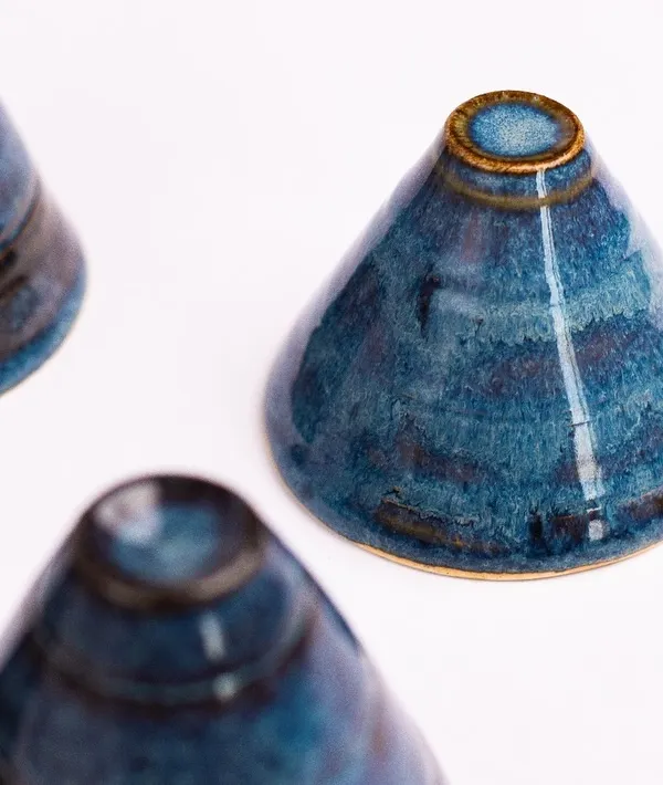 This is "Midnight Blue," one of our most popular Trana glazes. It’s a deep, rich blue that often breaks into beautiful reds, browns, and blacks after firing, making every piece unique.