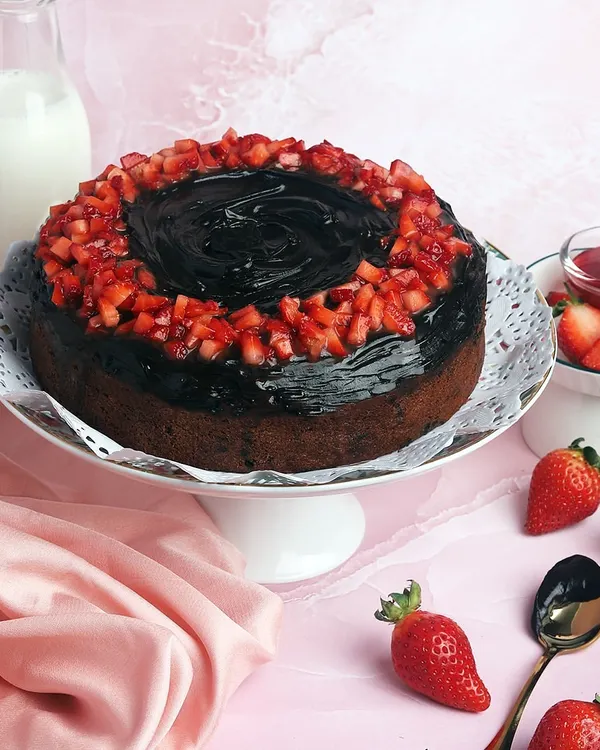 My special Strawberry Ganache Cake is a true celebration of the season. The rich chocolate ganache is topped with fresh, juicy strawberries, making every bite a delight.