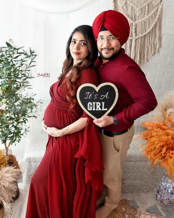 A beautiful couple announcing their baby girl in our boho studio. I love using props like this little chalkboard heart to make your pregnancy announcement extra special.