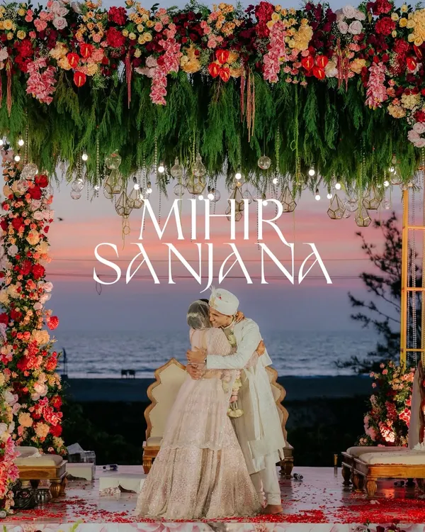 A perfect end to a perfect day. I always look for these magical moments, like this embrace under a stunning floral mandap as the sun sets over the sea in Goa. This is the essence of destination wedding photography.