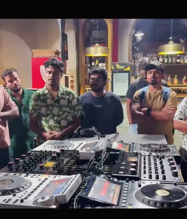 My teaching philosophy is simple: get hands-on with real, professional equipment. Here I am walking a group of aspiring DJs through the features of a full Pioneer DJ setup during a masterclass in Hyderabad.