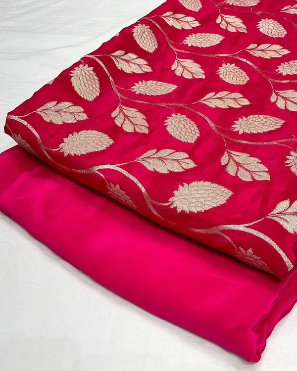 This vibrant rani pink jacquard fabric features a beautiful woven leaf pattern. I've paired it with a matching plain crepe silk, perfect for creating a coordinated kurta and bottom set.