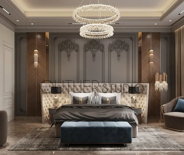Creating a space where elegance meets comfort. This master bedroom features a tufted headboard set against a backdrop of classic wall mouldings and chevron-patterned veneer panels, with a pop of deep blue for sophistication.
