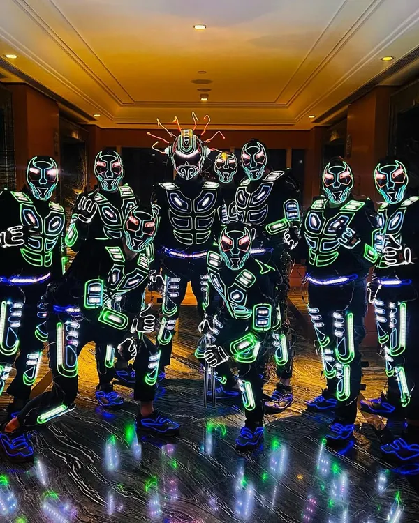 Our full crew assembled in our latest generation of robotic Tron suits. The detail in these costumes, with their glowing green and white patterns, is designed for maximum visual impact on stage.