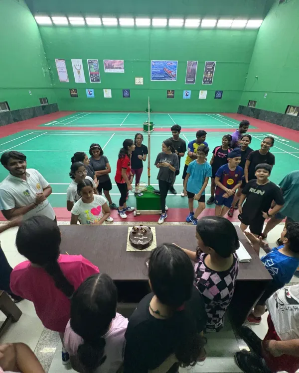 Celebrating World Badminton Day with a cake on the court. It’s a day to celebrate the sport we love with the people who make our academy special.