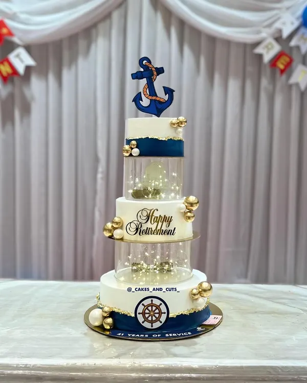 This five-tier navy-themed cake was a proud moment for us, created for a very special retirement party. We teach the structural engineering behind building tall, stable cakes like this, including how to incorporate elements like acrylic separators and internal lighting, in our advanced workshops.
