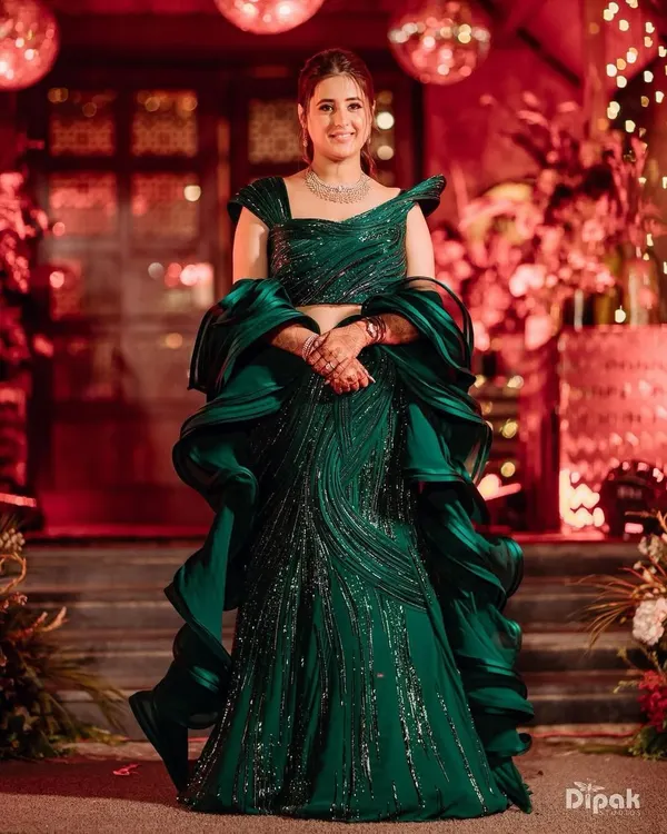 A bride glowing in a magnificent emerald green sculpted gown by Gaurav Gupta for her cocktail night. My styling focused on the dramatic ruffles and sparkling details of the dress.