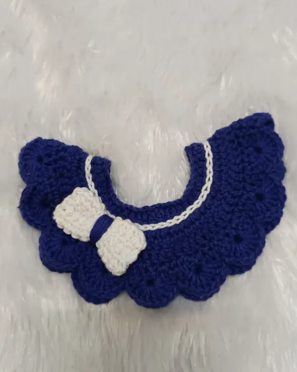 I love making these sweet detachable collars for little ones. This one is a lovely royal blue with a white bow, all handmade from soft, 100% cotton yarn that's gentle on baby's skin.