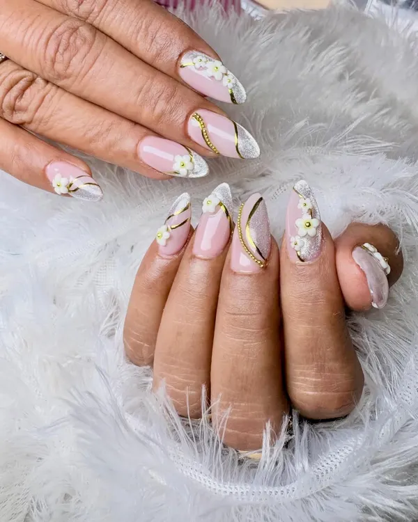 This is the kind of elegant nail art I love to create. It features a soft pink base with delicate, hand-sculpted 3D white flowers, accented with graceful gold swirls for a touch of luxury. Perfect for anyone wanting a sophisticated and timeless look.