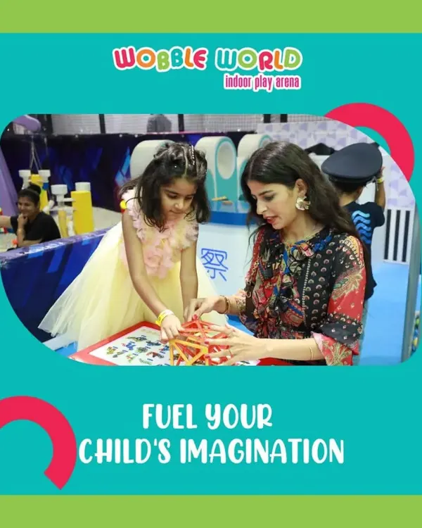 A mother and daughter work on a creative building game together. We offer a variety of activities that fuel your child's imagination.