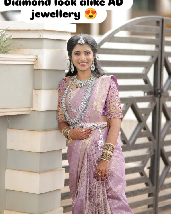 This is the perfect example of how my American Diamond sets give you a stunning, diamond-like sparkle for your big day. This happy bride is wearing a complete rental set, including the layered necklace, maang tikka, earrings, and waist belt, all coordinated to create a breathtaking reception look.