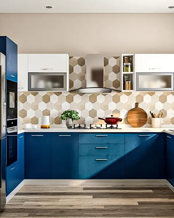 A modern U-shaped kitchen I designed with bold blue base cabinets and white overhead units. The hexagonal tile backsplash adds a graphic element, and the layout provides an efficient workflow.