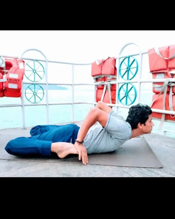 Bhekasana, the Frog Pose, provides a deep stretch for the quadriceps and hip flexors while opening the chest. This back-bending asana is excellent for improving posture and stimulating the abdominal organs.