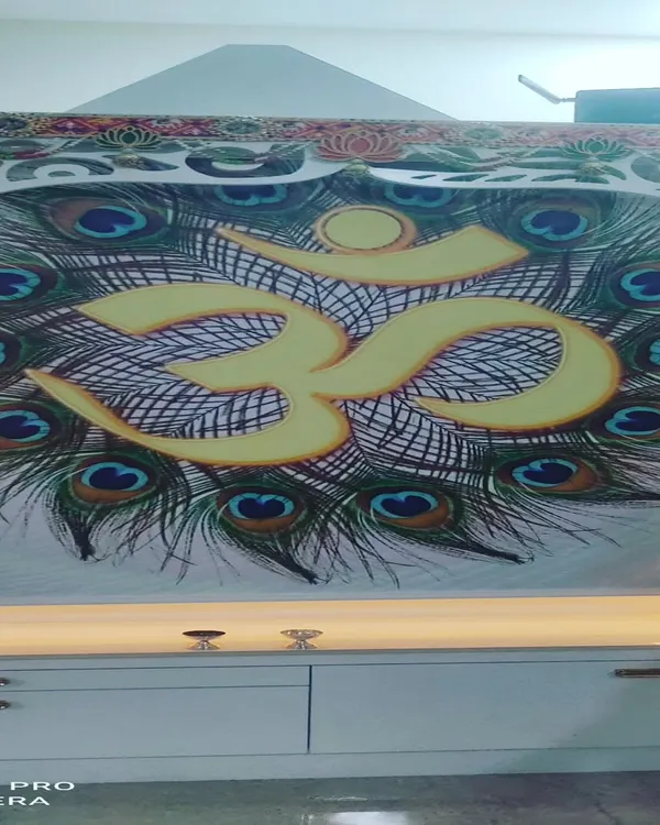 A custom printed roller blind I created for a puja room, featuring an 'Om' symbol with peacock feathers. If you have a specific design or image in mind, I can print it on a blind for you.
