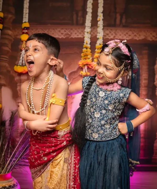 The playful mischief of Radha and Krishna, beautifully enacted by these two siblings. Our themed shoots are a wonderful way for children to have fun while creating culturally rich and memorable photographs.