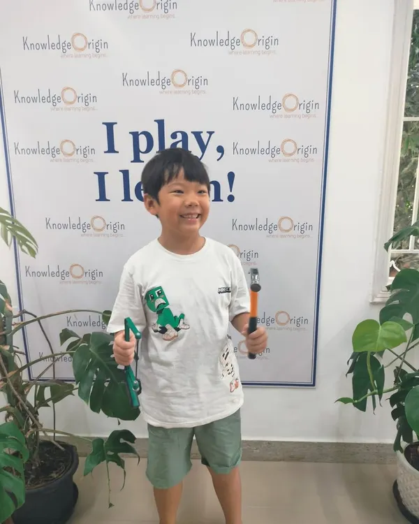 I build, I learn! This is what my camps are all about: empowering children by letting them use real tools under my guidance. Seeing the pride on this young camper's face after learning to use a hammer and saw safely is exactly why I focus on hands-on STEM skills.