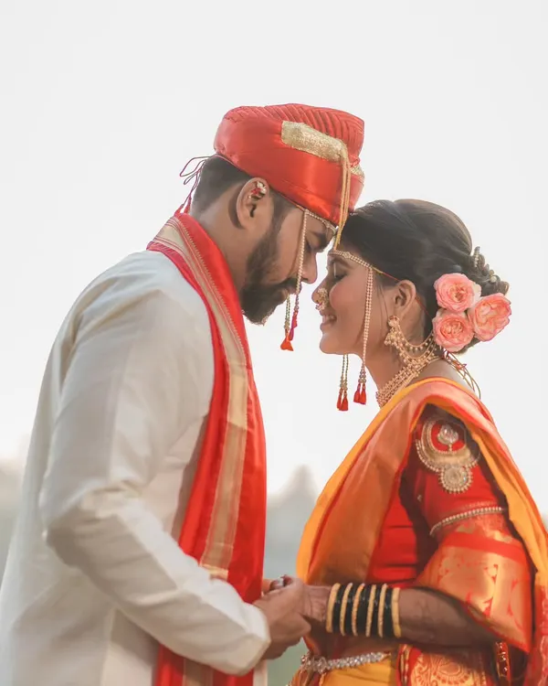 The moment just before a kiss, full of anticipation and love. This intimate close-up of a Maharashtrian couple captures the pure emotion of their wedding day.