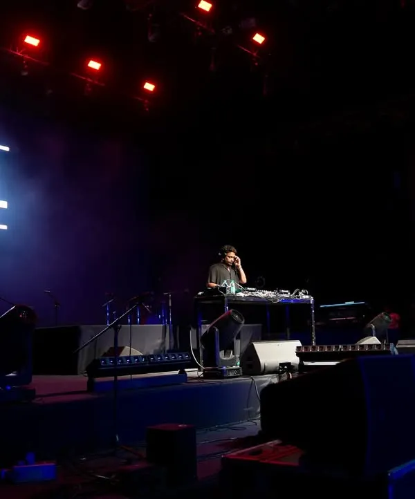 A side view of me on the main stage at NSCI Dome. The scale of the production was massive, and it was an honor to set the vibe.