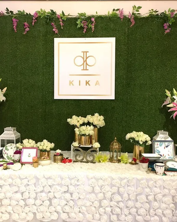 The main product display for a KIKA Tableware trunk show, designed to be the focal point of the event. I built a custom hedge wall as a natural backdrop for the brand's logo and arranged their products amidst lush floral arrangements to highlight their quality and design.