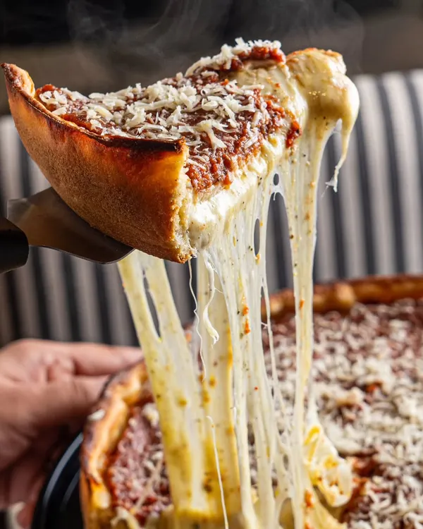 We specialize in capturing those mouth-watering moments that viewers crave. This deep-dish pizza cheese pull for a restaurant client is a perfect example of how we create dynamic, scroll-stopping food photography that drives engagement.
