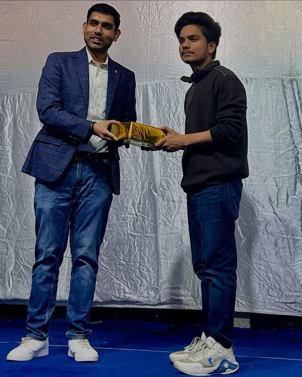 A proud moment receiving an award from Shri Mohan Singh Meena at a cultural program for my contributions. Recognition for my art always motivates me to work harder.