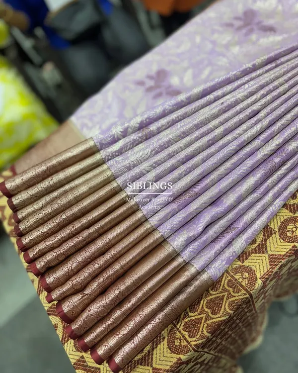 Mastering the art of fluffy pleats in our workshop. Each pleat is carefully crafted and ironed to perfection.