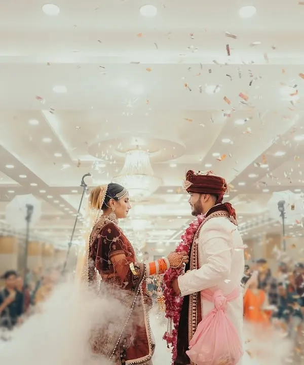 The Varmala is such a peak moment of the wedding. I love to make it feel as epic as it is, using effects like this cloud of smoke and confetti to create a truly cinematic and unforgettable memory of the couple's exchange.