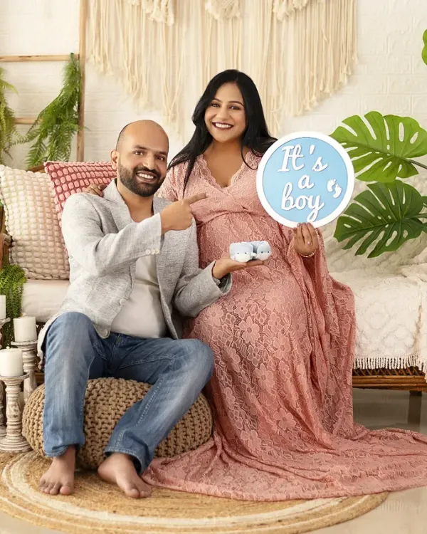 Our boho setup is perfect for happy announcements. This couple used our 'It's a boy' sign to share their news in a relaxed, natural setting surrounded by plants and textures.