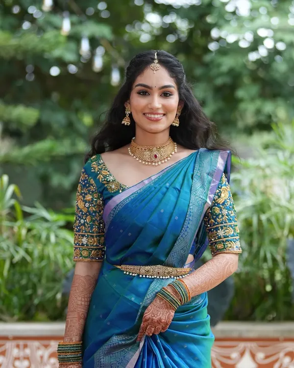 A joyful portrait of the bride-to-be. Her makeup is kept fresh and luminous to complement the daytime event, with soft contouring and a natural lip color.