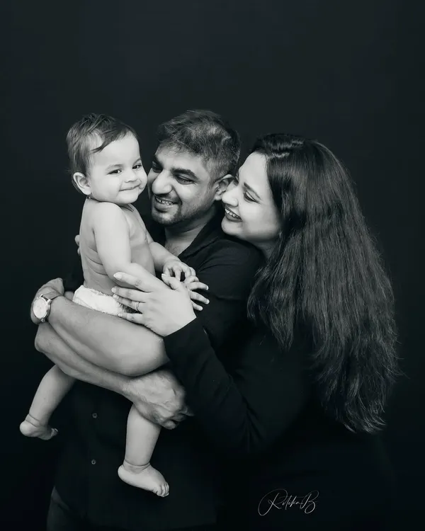 This is the essence of my work. A black and white family portrait where the focus is purely on the love and connection between parents and their child. It's simple, powerful, and timeless.