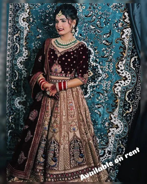 This is one of my most requested bridal looks. A rich maroon velvet blouse and detailed lehenga paired with a stunning green beaded Kundan necklace set. This rental is perfect for a classic winter wedding.