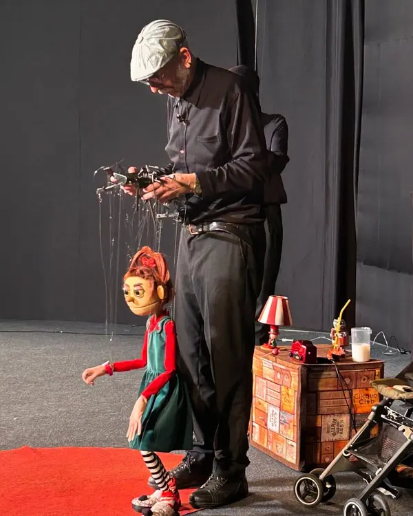 A puppeteer from Italy's Compagnia La Fabiola masterfully handles the strings of a character from 'Pay Attention to Those Two'. This string puppet performance is a hilarious musical adventure about friendship and self discovery.