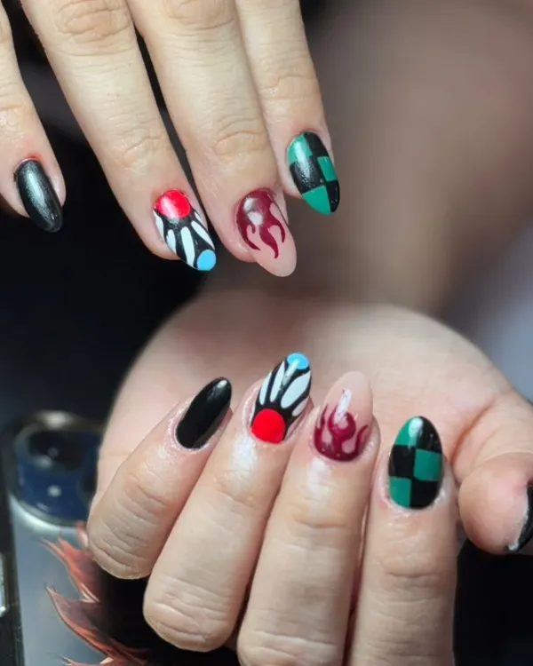 This detailed 'Demon Slayer' inspired set shows my passion for character art. Each nail is a tiny canvas, featuring hand-painted designs like Tanjiro's checkered haori and Nezuko's flame pattern, perfect for any anime fan.