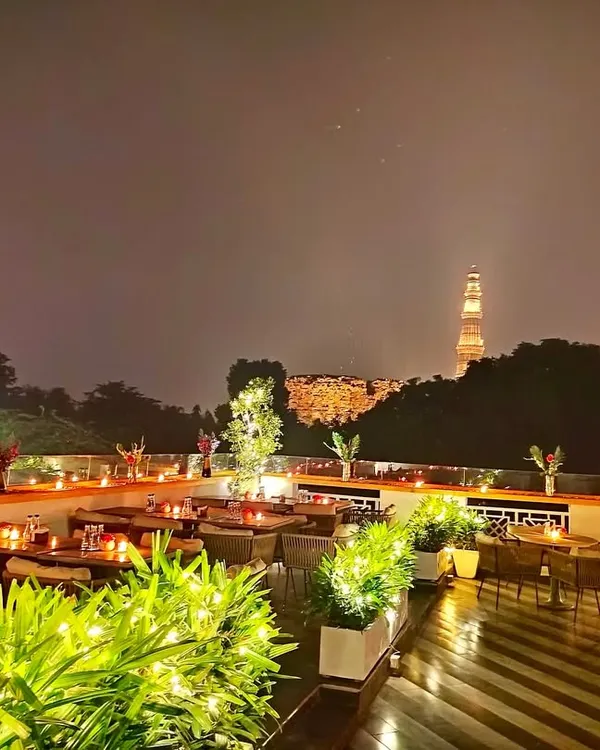 This is the view that feeds the soul. I invite you to our terrace, where evenings are lit by candlelight and the timeless watch of the Qutub Minar, creating a truly unforgettable atmosphere.