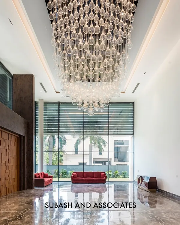 I believe a grand entrance sets the tone for the entire property. This double-height lobby uses polished marble floors, expansive glass walls, and a cascading crystal chandelier to create a breathtaking sense of arrival and architectural brilliance.
