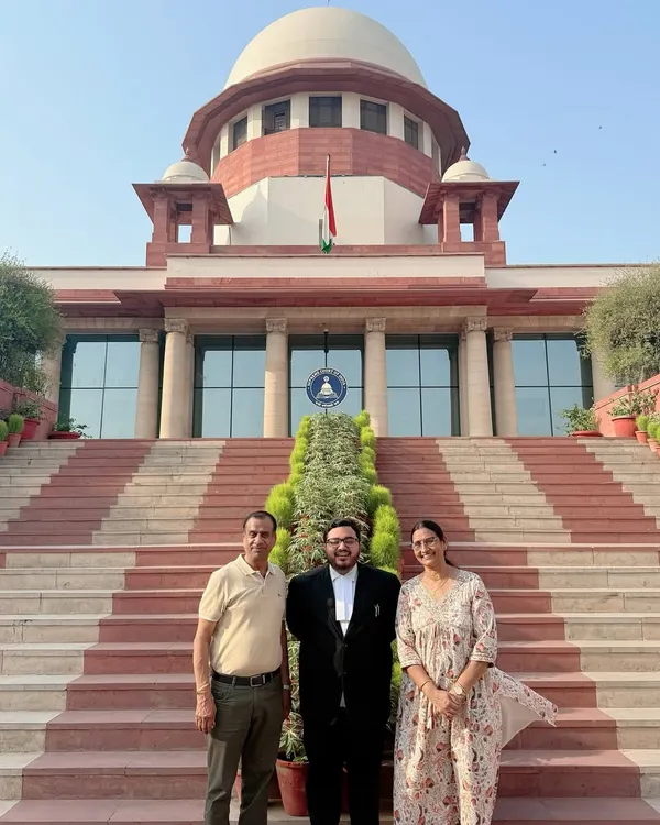 Sharing a lighthearted moment with my parents at the Supreme Court. Their support has been a constant throughout my journey.