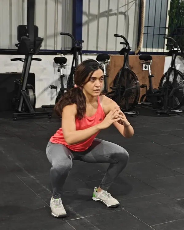 This workout challenged muscular stamina with static holds. Here, a member demonstrates a perfect squat hold, building isometric strength and mental toughness.
