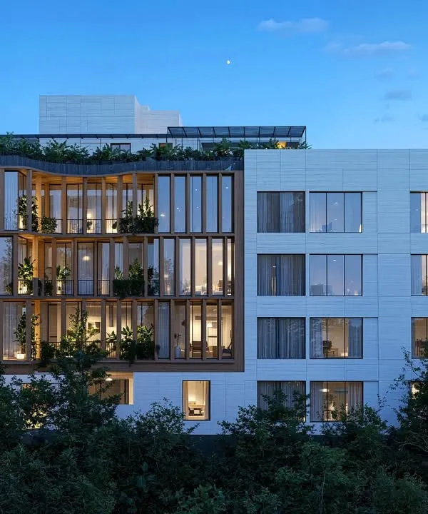 Different perspectives of the Amara Avika apartments in Chennai, showing the interplay of the wood-framed public zones and the solid private areas, both during the day and at dusk.