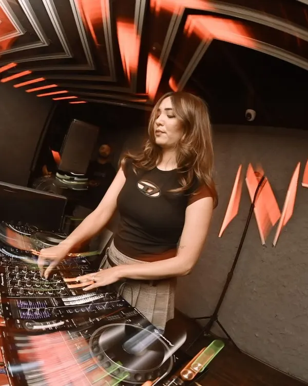 Dropping beats under the wild lights in Guwahati. I love playing for new crowds and feeling how different cities party. Here I am, focused on the mixer, building up the energy for the next drop.
