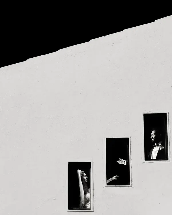 A Fearless Award-winning shot. I used the simple, repeating windows of a building to create this minimalist, high-contrast portrait that tells a story of connection and distance.
