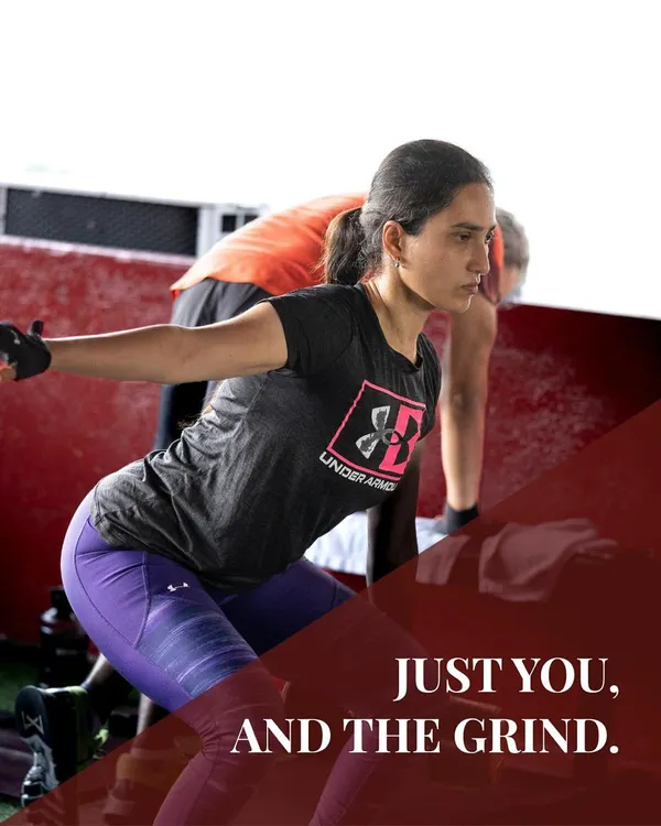 Just you, and the grind. This image captures the intense focus of a client during a dynamic workout, highlighting the dedication required to achieve results.