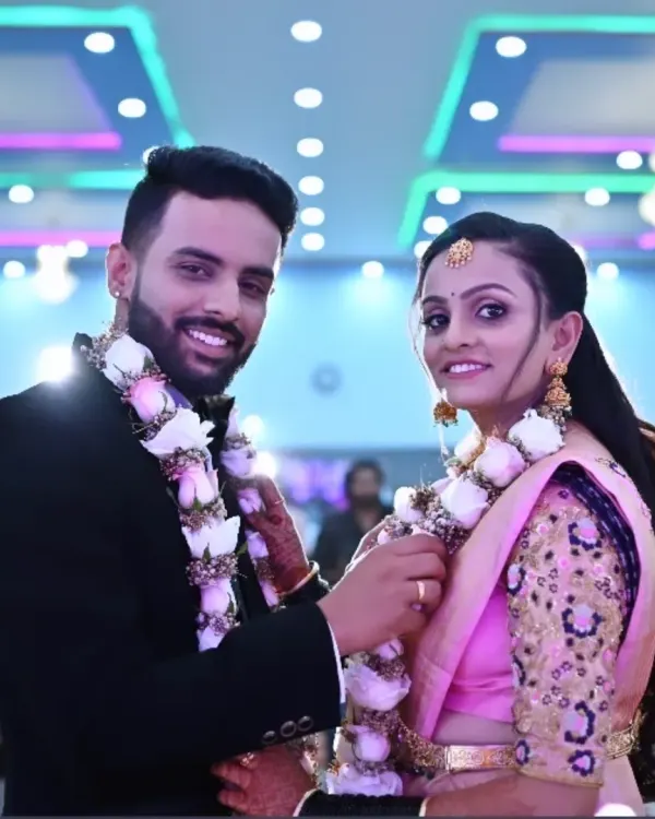 A beautiful, happy moment between the bride and groom during their reception. Her makeup looks flawless and her smile is infectious.