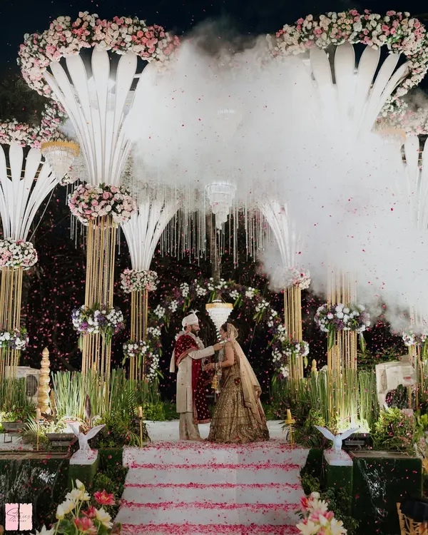 A truly magical varmala moment, complete with a 'walking on clouds' effect. I use special effects like dry ice and cold pyros to elevate key moments, making your wedding ceremony feel like a scene from a fairytale.